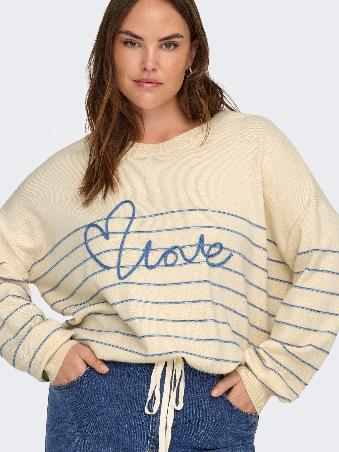 Pull Signe – Pull rayé avec message brodé