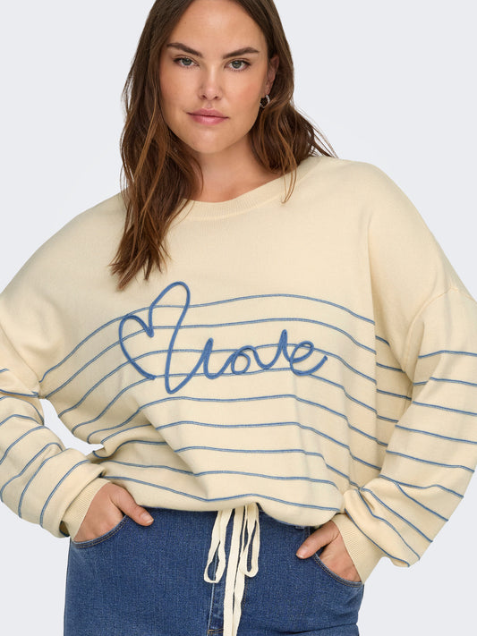 Pull Signe – Pull rayé avec message brodé