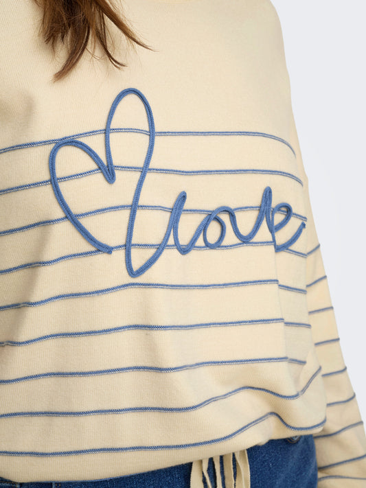 Pull Signe – Pull rayé avec message brodé