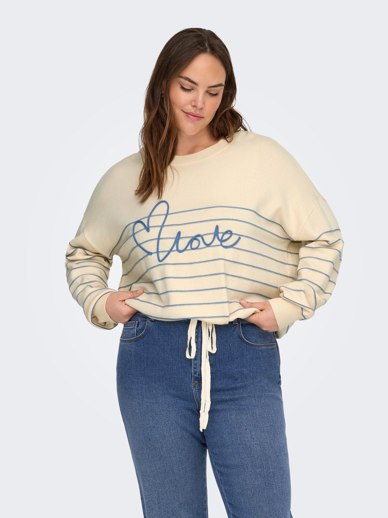 Pull Signe – Pull rayé avec message brodé